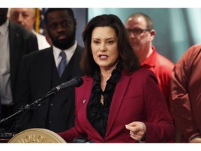 In this Tuesday, Feb. 26, 2019 photo, Michigan Gov. Gretchen Whitmer talks about the proposed new Chrysler auto plant in Detroit. Whitmer said Wednesday, Feb. 27, that Michigan's incentives for Fiat Chrysler to add 6,500 jobs in the state will not require legislative approval. She said the state will use existing economic development programs to assist the automaker's planned $4.5 billion expansion, which was announced Tuesday.