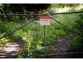 FILE - In this Aug. 16, 2017 file photo, a "No trespassing" sign is displayed at an old tannery waste dump used by Wolverine World Wide in Belmont, Mich. Some private wells in the area have tested positive for elevated levels of perfluoroalkyl and polyfluoroalkyl  substances called PFAS, also called perfluorinated chemicals, or PFCs. There's growing evidence that long-term exposure to the perfluoroalkyl and polyfluoroalkyl compounds, or PFAS, can be dangerous, even in tiny amounts.  The Environmental Protection Agency is looking at how to respond to a public push for stricter regulation of the chemicals, in production since the 1940s.  A decision is expected soon.