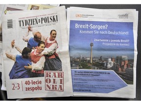 In this Tuesday, Feb. 12, 2019 photo, an advertisement of the Duesseldorf University Medical Center in Germany reads "Brexit worries? Come to Germany!" in Polish newspapers in the UK, placed for a photo on a table at the hospital in Duesseldorf. The German hospital wants to hire Polish nurses who may leave the United Kingdom because of the Brexit.