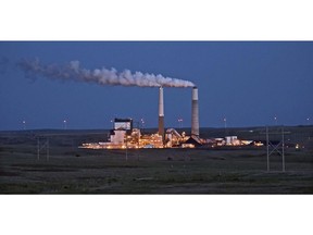 FILE - In this May 25, 2017, file photo, the Milton R. Young Station lignite coal-fired power plant near Center, N.D., glows as dusk blankets the North Dakota prairie landscape. The U.S. Environmental Protection Agency announced Tuesday, Feb. 26, 2019, it will retain the standard for sulfur dioxide pollution established in 2010 under President Barack Obama. Sulfur dioxide comes from burning coal to produce electricity and from other industrial sources.