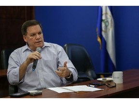 In this Feb. 8, 2019 photo, Jose Adan Aguerri, president of the High Council of Private Enterprise, speaks during a press conference in Managua, Nicaragua.  Aguerri contends the government's new plan to cut pension payments and raise payroll taxes will cause more joblessness and capital flight, run businesses into bankruptcy and inflate the cost of basic goods.