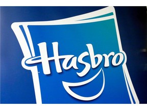 FILE - This April 26, 2018, file photo, shows the Hasbro logo at the TTPM 2018 Spring Showcase, in New York.  Hasbro returned to a profit in its fourth quarter, but the toy company's performance still fell short of Wall Street's expectations as it continues to deal with the demise of Toys R Us. Shares tumbled more than 8 percent in Friday, Feb. 8, 2019 premarket trading.