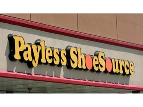 FILE- This Aug. 23, 2006, file photo shows a Payless store front is seen in Philadelphia. Paylesss ShoeSource is shuttering all of its 2,100 remaining stores in the U.S. and Puerto Rico, joining a list of iconic names like Toys R Us and Bon-Ton that have been shuttered in the last year. The Topeka, Kansas-based chain said Friday, Feb. 15, 2019 it will hold liquidation sales starting Sunday and wind down its e-commerce operations.