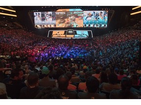 FILE - In this July 28, 2018, file photo, fans watch the competition between Philadelphia Fusion and London Spitfire during the Overwatch League Grand Finals competition at Barclays Center in the Brooklyn borough of New York. With eight new franchises and plans to take its regular season on the road for the first time, the Overwatch League is opening its second year a few steps closer to its goal of becoming a truly global, city-based esports league.