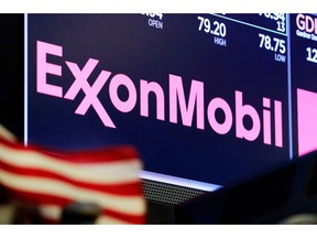 FILE - In this April 23, 2018, file photo, the logo for ExxonMobil appears above a trading post on the floor of the New York Stock Exchange. Exxon Mobil is making a big bet on the future of exporting natural gas. Exxon and Qatar Petroleum announced Tuesday, Feb. 5, 2019, that they will go ahead with a $10 billion project to expand a liquefied natural gas export plant on the Texas Gulf Coast.