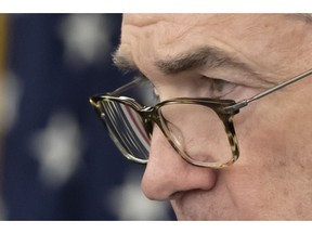 FILE- In this Jan. 30, 2019, file photo Federal Reserve Chairman Jerome Powell listens to a reporter's question at a news conference in Washington. Powell plans to speaks to a group of teachers in Washington on Wednesday, Feb. 6.