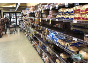 FILE- This Feb. 7, 2019, file photo shows the bread section of a Safeway store in Tacoma, Wash. On Wednesday, Feb. 13, 2019, the Labor Department reports on U.S. consumer prices for January.