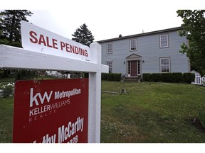 FILE- This June 15, 2018, file photo shows a "sale pending" sign is posted outside a home in East Derry, N.H. On Wednesday, Feb. 27, 2019, the National Association of Realtors releases its January report on pending home sales, which are seen as a barometer of future purchases.