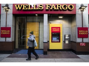 FILE- This Nov. 29, 2018, file photo shows a Wells Fargo bank location in Philadelphia. Wells Fargo customers are experiencing issues with accessing online or mobile banking as well as other banking services, after a fire happened at one of the bank's data centers.