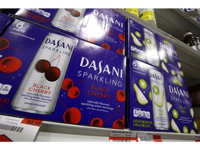 FILE- This Nov. 14, 2018, file photo shows Dasani sparkling water, a Coca-Cola product, on display at a market in Pittsburgh. The Coca-Cola Co. reports financial results Thursday, Feb. 14, 2019.