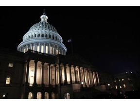 FILE- In this Feb. 5, 2019, file photo lights illuminate the U.S. Capitol dome in Washington. On Thursday, Feb. 14, the Labor Department reports on the number of people who applied for unemployment benefits last week.