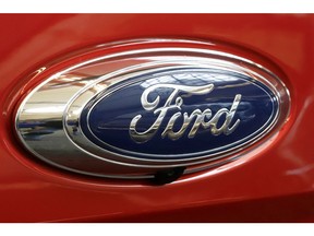 FILE- In this Feb. 14, 2019, file photo this is the Ford logo on a 2019 Ford Ranger 2019 Supercrew 4x4 on display at the 2019 Pittsburgh International Auto Show in Pittsburgh. Ford says it has launched an investigation into whether a flawed mathematical model caused it to overstate gas mileage and understate pollution from a wide range of vehicles. The company says a group of employees reported possible problems with the model in September. So it has hired an outside firm to test the 2019 Ford Ranger.