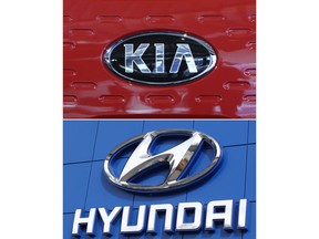 FILE- This combination of file photos shows the logo of Kia Motors during an unveiling ceremony on Dec. 13, 2017, in Seoul, South Korea, top, and Hyundai logo on the side of a showroom on April 15, 2018, in the south Denver suburb of Littleton, Colo., bottom. Hyundai and Kia are recalling more than a half million vehicles in the U.S. because of new problems that can lead to engine fires. Documents posted Thursday, Feb. 28, 2019, by the government show the Korean automakers are adding three recalls after reports of fires across the country. (AP Photo, File)