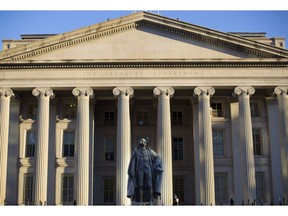 FILE - This June 8, 2017, file photo shows the U.S. Treasury Department building in Washington. The national debt has passed a new milestone, topping $22 trillion for the first time. The Treasury Department's daily statement shows that total outstanding public debt stands at $22.01 trillion. It stood at $19.95 trillion when President Donald Trump took office on Jan. 20, 2017.