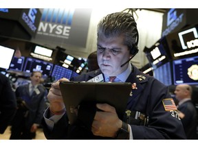 FILE- In this Feb. 5, 2019, file photo trader John Panin works on the floor of the New York Stock Exchange. The U.S. stock market opens at 9:30 a.m. EST on Monday, Feb. 11.