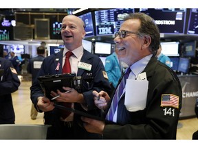 FILE- In this Feb. 15, 2019, file photo traders Patrick Casey, left, and Sal Suarino work on the floor of the New York Stock Exchange. The U.S. stock market opens at 9:30 a.m. EST on Wednesday, Feb. 27.