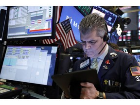 FILE- In this Feb. 15, 2019, file photo trader John Panin works on the floor of the New York Stock Exchange. The U.S. stock market opens at 9:30 a.m. EST on Thursday, Feb. 21.