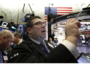 Trader Michael Capolino works on the floor of the New York Stock Exchange, Friday, Feb. 8, 2019. Stocks are opening lower on Wall Street as a mixed bag of earnings reports didn't inspire investors to get back to buying stocks.