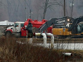 Excavation equipment is used to search for an oil leak close to where the TransCanada Corp's Keystone oil pipeline runs through northern St. Charles County, Missouri.