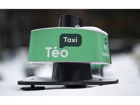 A taxi dome is seen in a Teo Taxi parking lot in Montreal on Tuesday, January 29, 2019. The head of media conglomerate Quebecor has confirmed his personal financial interest in restarting insolvent electric transportation firm Teo Taxi, provided that certain rules about the industry are changed.