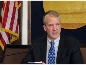 U.S. Sen. Dan Sullivan speaks to reporters after giving his annual address to a joint session of the Alaska Legislature on Thursday, Feb. 21, 2019, in Juneau, Alaska. Sullivan said he did not think a 90-day comment period was adequate for a draft environmental review of the proposed Pebble Mine project in Alaska's Bristol Bay region.