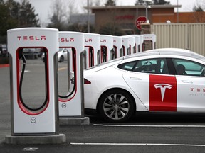 Tesla cars recharge at a Tesla Supercharger facility on January 30, 2019 in Petaluma, California.