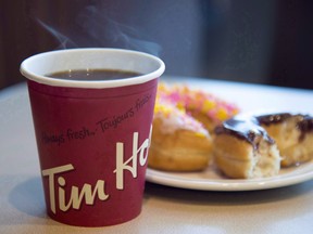 A Minnesota company that planned to open hundreds of Tim Hortons coffee shops has filed a lawsuit against the chain and parent company Restaurant Brands International.