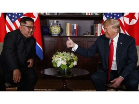 FILE - In this June 12, 2018, file photo, U.S. President Donald Trump, right, meets with North Korean leader Kim Jong Un on Sentosa Island, in Singapore. Trump's message to North Korea has been simple and clear: give up your nuclear weapons and a flood of wealth will soon be yours for the taking.