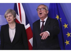 British Prime Minister Theresa May, left, is greeted by European Commission President Jean-Claude Juncker prior to a meeting at EU headquarters in Brussels, Wednesday, Feb. 20, 2019. European Commission President Jean-Claude Juncker and British Prime Minister Theresa May meet Wednesday for their latest negotiating session to seek an elusive breakthrough in Brexit negotiations.