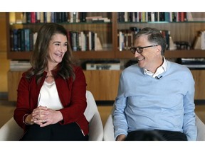 In this Feb. 1, 2019, Bill and Melinda Gates look toward each other and smile while being interviewed in Kirkland, Wash. The couple, whose foundation has the largest endowment in the world, are pushing back against a new wave of criticism about whether billionaire philanthropy is a force for good. They said they're not fazed by recent blowback against wealthy giving, including viral moments at the World Economic Forum and the shifting political conversation about taxes and socialism.