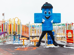 Alberta Blue Cross mascot, Big Blue, attends opening of a playground that is part of the organization’s Healthy Communities Grant Program.