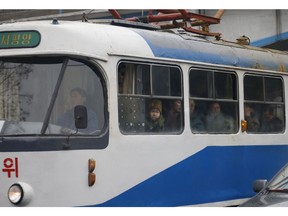 In this Sunday, Feb. 3, 2019 photo, people ride on a tram in Pyongyang, North Korea. Pyongyang is upgrading its overcrowded mass transit system with brand new subway cars, trams and buses in a campaign meant to show leader Kim Jong Un is raising the country's standard of living.