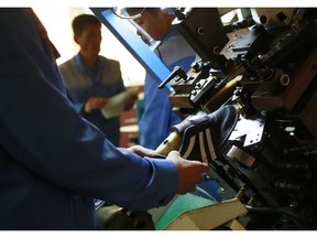 In this Friday, Feb. 1, 2019, photo, workers make sneakers at the Ryuwon Shoe Factory that specializes in sports footwear, in Pyongyang, North Korea. North Korean pop culture, long dismissed by critics as a kitschy throwback to the dark days of Stalinism, is getting a major upgrade under leader Kim Jong Un. The changes are being seen in everything from television dramas and animation programs to the variety and packaging of consumer goods, which have improved significantly under Kim.