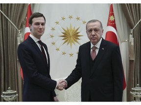 Turkey's President Recep Tayyip Erdogan, right, shakes hands with Jared Kushner, left, U.S. President Donald Trump's adviser, prior to their meeting at the Presidential Palace in Ankara, Turkey, Wednesday, Feb. 27, 2019. Erdogan met with with U.S. President Donald Trump's adviser and son-in-law for talks that are expected to centre on his planned Mideast peace initiative. Turkey's Economy Minister Berat Albayrak, who is Erdogan's son-in-law, was also present. (Presidential Press Service via AP, Pool)
