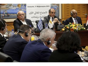 Cypriot Parliamentary Speaker Demetris Syllouris, center, with his counterparts Ali Abdel-Aal of Egypt, right, and Nikos Voutsis of Greece, left, talk during a press conference in the parliament house in capital Nicosia, Cyprus, Monday, Feb. 11, 2019. Syllouris, Abdel-Aal and Voutsis agreed on strengthening cooperation especially in the fields of energy, tourism, education and culture.
