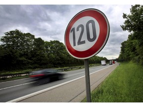 FILE - In this May 15, 2013 file photo a traffic sign indicating a speed limit of 120 km/h (75 mph) is pictured at the highway A59 close to Troisdorf, Germany. European Union officials have struck a provisional political deal to require new safety features on autos that would include technology to keep cars within legal speed limits. So-called intelligent speed assistance recognizes the prevailing speed laws on a stretch of road using mapping systems and limits engine power to help the driver avoid speeding.