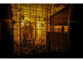 In this Nov. 20, 2013 photo, seen through thick protective glass, shows the area where workers sand-blast the large stainless steel tanks used in the vitrification process to rid them of contaminates at the Defense Waste Processing Facility at the Savannah River Site near Aiken, S.C. Nevada's latest bid to block incoming shipments of weapons-grade plutonium points to the U.S. Energy Department's own scientific warnings about the dangers of prematurely moving the highly radioactive material out of South Carolina.