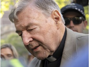 FILE - In this Feb. 27, 2019, file photo, Cardinal George Pell arrives at the County Court in Melbourne, Australia. Pell, the most senior Catholic to be convicted of child sex abuse, will be sentenced to prison Wednesday in an Australia landmark case that has polarized observers. High-profile Australian journalists face possible prison sentences, and large media organizations could face fines after being ordered to appear in court next month for allegedly breaching a gag order on reporting about Pell's convictions on charges of sexually molesting two choirboys.
