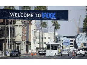 Cars enter and leave Fox Studios, Tuesday, March 19, 2019, in Los Angeles. Disney has closed its $71 acquisition of Fox's entertainment business on Wednesday, March 20, in a move set to shake up the media landscape. The closure paves the way for Disney to launch its streaming service, Disney Plus, due out later this year.