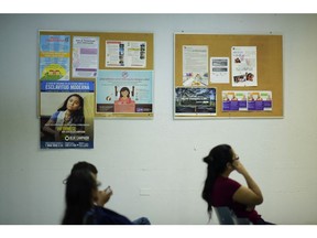 Puerto Rican citizens wait their turn at the Department of Family Affairs, in Bayamon, Puerto Rico, Friday, March 29, 2019. Hundreds of thousands of Puerto Ricans are feeling the sting of what the territorial government says are insufficient federal funds to help the island recover from the Category 4 storm amid a 12-year recession.