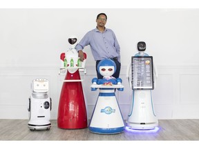 Ian McGowan CEO of Autonetics Universe is pictured with robots, left to right, 'Sanbot Nano' 'Beauty' 'Loloita' and 'Amy Plus' at Rap Riderz Innovation Centre in Aurora, Ont. on Wednesday, March 20, 2019.