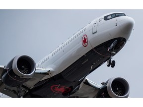 An Air Canada Boeing 737 Max aircraft arriving from Toronto prepares to land at Vancouver International Airport in Richmond, B.C., on March 12, 2019. Boeing's share price has dropped more than 11 per cent -- a loss of more than US$26.6 billion -- since the plane maker's 737 Max 8 fatally crashed Sunday, but Canada's two largest airlines have emerged nearly unscathed. Air Canada and WestJet Airlines Ltd. saw their stocks decline about 3.4 per cent and 2.5 per cent, respectively, since the Ethiopian Airlines disaster that killed all 157 people on board.