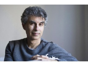 Computer Science professor Yoshua Bengio poses at his home in Montreal on November 19, 2016. Two of Canada's artificial intelligence pioneers are warning about the consequences of AI in robotic weapons and outsourcing lethal decisions to machines, calling for an international agreement on its deployment as Canada marches toward the binary battlefield. Geoffrey Hinton and Yoshua Bengio, who along with computer scientist Yann LeCun won the Turing Award on Wednesday -- known as the Nobel Prize of the technology industry -- so-called weaponized AI and killer robots could spell danger for civilians.