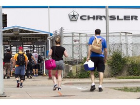 Workers arrive for their shift at the Fiat Chrysler Automobiles (FCA) assembly plant in Windsor, Ont., on June 12, 2018. Federal Economic Development Minister Navdeep Bains says he'll travel to Windsor Saturday to offer support to workers facing layoffs by Fiat Chrysler Automobiles N.V. The company announced Thursday it would cut the third shift at its Windsor plant at the end of September at a loss of about 1,500 jobs.