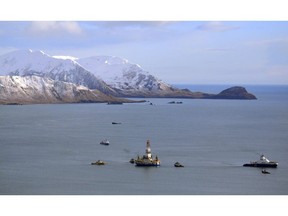 An oil and gas industry representative says Canada is falling behind the U.S. and other Arctic nations in developing its rich natural resources because of a five-year moratorium on offshore drilling until at least 2021. The floating drill rig Kulluk in Kodiak Island, Alaska's Kiliuda Bay as salvage teams conduct an in-depth assessment of its seaworthiness on Jan. 7, 2013.