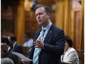 Parliamentary Secretary to the Minister of Natural Resources Paul Lefebvre rises during Question Period in the House of Commons on Parliament Hill in Ottawa on Friday, Oct. 5, 2018. Northern leaders are cheering after Ottawa announced funding to begin planning and design work for a long-awaited road into the heart of Canada's mineral-rich Arctic.