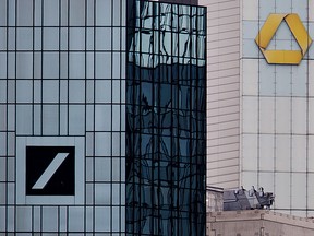 Headquarters of Deutsche Bank, left, and Commerzbank are seen in Frankfurt as Germany’s two biggest banks begin talks on a possible merger.