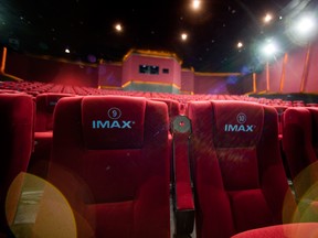 Seats in a theater display the Imax Corp. logo at a cinema in Beijing, China. Imax has a presence all over the world.
