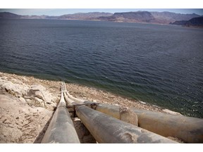 FILE - This March 23, 2012, file photo shows pipes extending into Lake Mead well above the high water mark near Boulder City, Nevada. A major southern California utility is positioning itself to shoulder the state's entire water contributions under a plan to preserve a key Western river. The Metropolitan Water District is voting Tuesday, March 12, 2019 on a proposal to take on the Imperial Irrigation District's share of water that would be stored behind Lake Mead. Seven Western states having been working for years on the Colorado River drought plan.