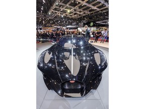 The New car Bugatti La voiture Noire is presented during the press day at the '89th Geneva International Motor Show' in Geneva, Switzerland, Tuesday, March 5, 2019. The 'Geneva International Motor Show' takes place in Switzerland from March 7 until March 17, 2019. Automakers are rolling out new electric and hybrid models at the show as they get ready to meet tougher emissions requirements in Europe - while not forgetting the profitable and popular SUVs and SUV-like crossovers.